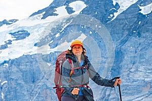 Sporty woman hiking in Switzerland alps