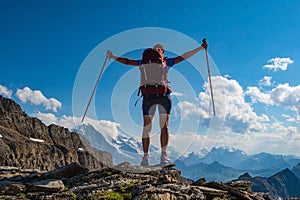 Sporty woman hiking in Switzerland alps