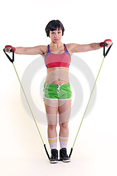 Sporty woman holding a exercise band in both hands