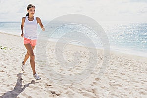 Sporty woman jogging at the beach