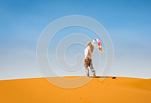 Sporty woman in Merzouga dunes of Sahara desert Morocco