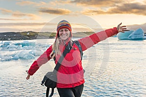 Sporty woman near Ice Glacier Jokulsarlon Lagoon, Iceland