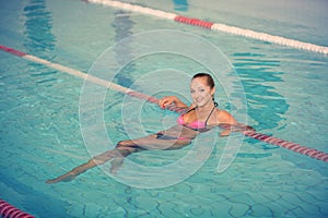 Sporty woman. picture of happy young girl swimming in pool
