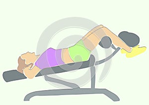 Sporty woman pumps the abdominals on inclined bench.