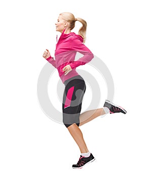 Sporty woman running or jumping