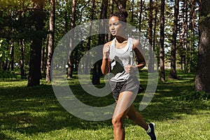 Sporty woman running in park