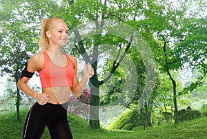 Sporty woman running with smartphone and earphones