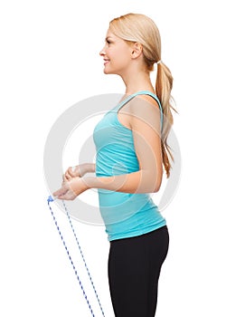 Sporty woman with with skipping rope