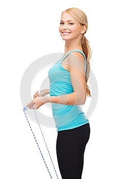 Sporty woman with with skipping rope