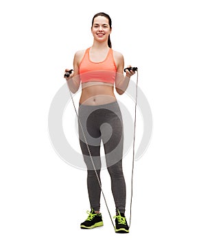 Sporty woman with with skipping rope