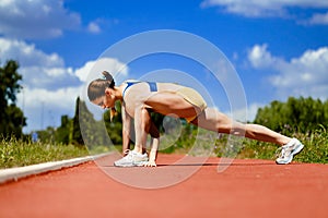 Sporty woman stretching