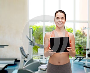 Sporty woman with tablet pc blank screen