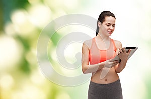 Sporty woman with tablet pc computer