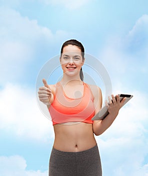 Sporty woman with tablet pc computer