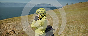 The sporty woman travels on a bicycle with bikepacking bags. The sportswoman traveler journey on bicycle touring in