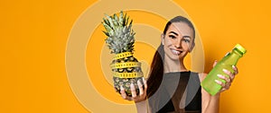 Sporty woman waist with measure tape and pineapple photo