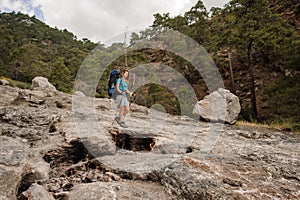 Sporty woman walking on the rocks of the Chimaera mountain