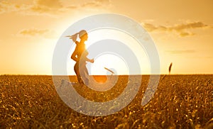 Sporty woman in wheat field