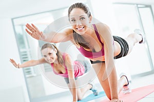 Sporty women doing pilates workout