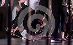 Sporty women exercising with a rubber bands