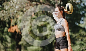 Sporty women having fun outdoors, throwing a rugby ball in a park. Enjoying nature and a healthy lifestyle.