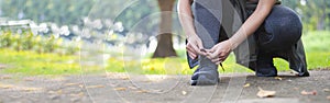 Sporty women are tied with running shoes to run exercise in the morning. Portrait of beautiful Women exercising in the park on