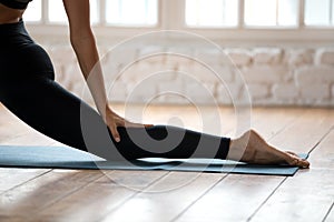 Sporty yogi woman practicing yoga, Horse rider exercise close up