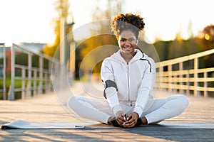 Sporty Young African American Female Practicing Yoga Outdoors