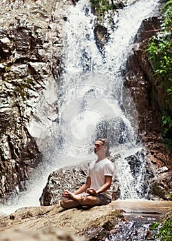 Sporty young man practicing yoga