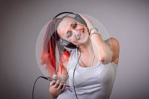 Sporty young woman dancing to music