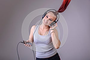 Sporty young woman dancing to music