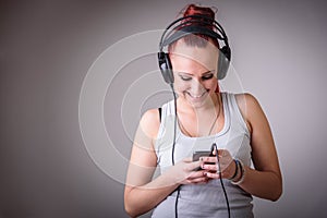 Sporty young woman dancing to music