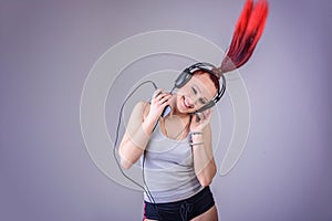 Sporty young woman dancing to music