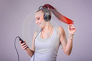 Sporty young woman dancing to music