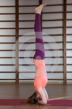 Sporty young woman doing yoga practice - concept of healthy life and natural balance between body and mental development