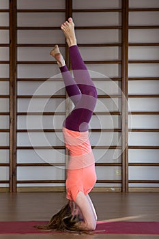 Sporty young woman doing yoga practice - concept of healthy life and natural balance between body and mental development