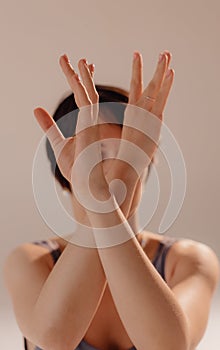 Sporty young woman doing yoga practice on white background. Concept of healthy life and balance between body and mental