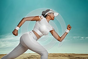 Sporty young woman and fit athlete runner running on the sky background. The concept of a healthy lifestyle and sport