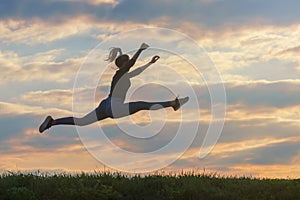 Sporty young woman jumping outdoor morning clouds background, Athlete Woman jump beautiful sunrise morning workout