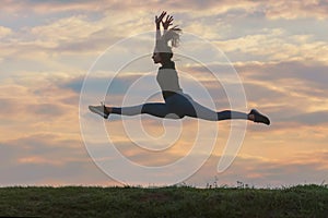 Sporty young woman jumping outdoor morning clouds background, Athlete Woman jump beautiful sunrise morning workout