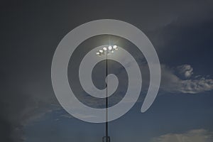 spot light pole against blue sky ;