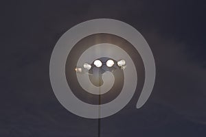 spot light pole against blue sky ;