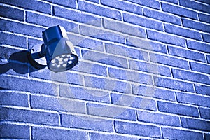 Spotlight against a new brick wall