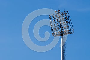 Spotlight with blue sky at stadium