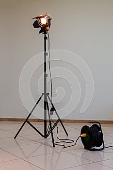 Spotlight with halogen bulb and Fresnel lens. Lighting equipment for Studio photography or videography