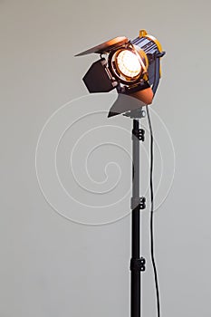Spotlight with halogen bulb and Fresnel lens. Lighting equipment for Studio photography or videography