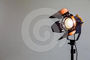 Spotlight with halogen bulb and Fresnel lens. Lighting equipment for Studio photography or videography photo