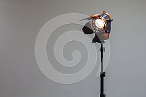 Spotlight with halogen bulb and Fresnel lens. Lighting equipment for Studio photography or videography