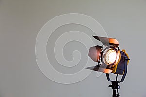 Spotlight with halogen bulb and Fresnel lens. Lighting equipment for Studio photography or videography