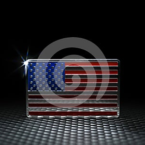 Spotlight on shiny US American flag emblem on carbon fiber. Symbolizing USA strength, Memorial day, Veteran\'s day